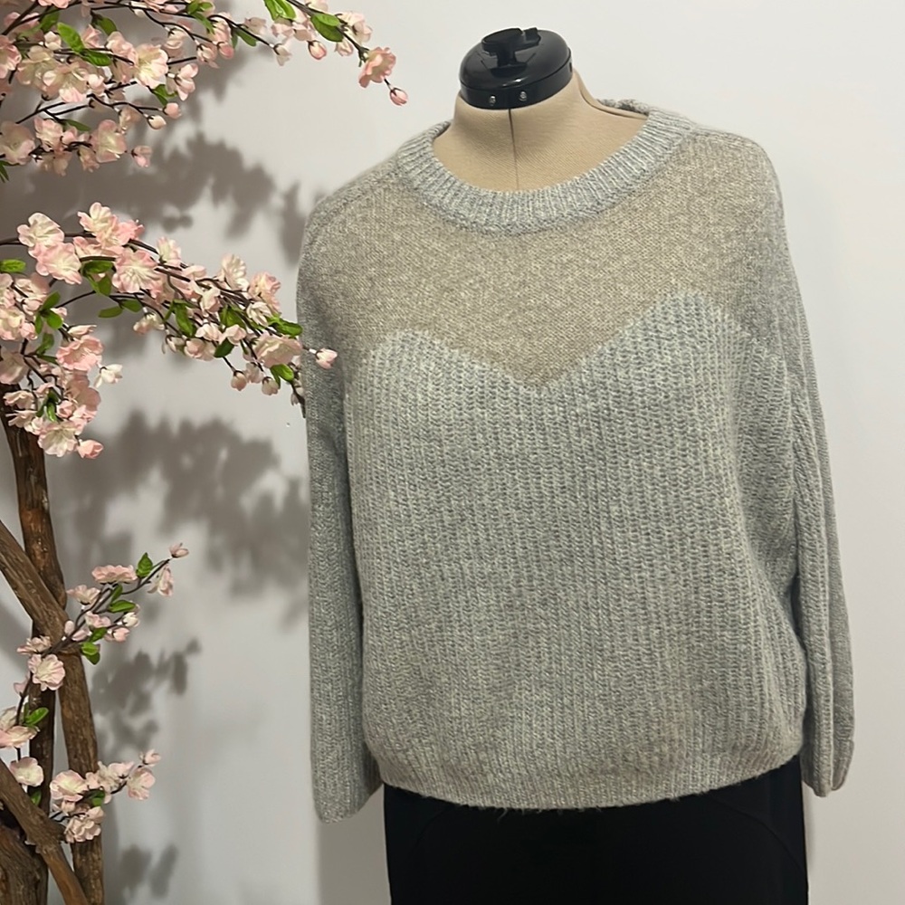 Gray knit sweater.
